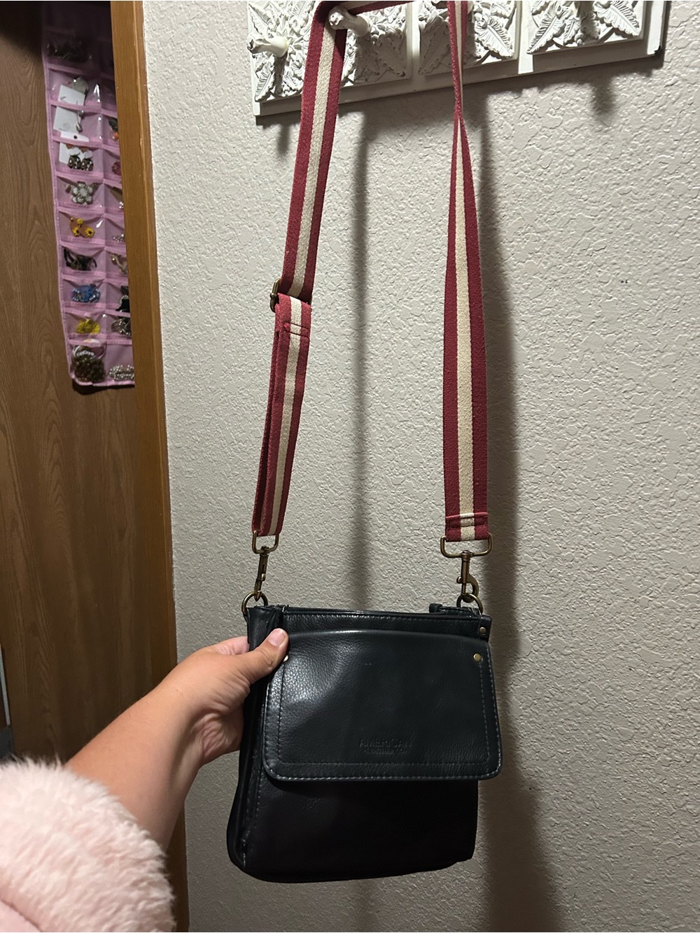 Black Leather Crossbody Bag with Pink-Striped Webbing Strap